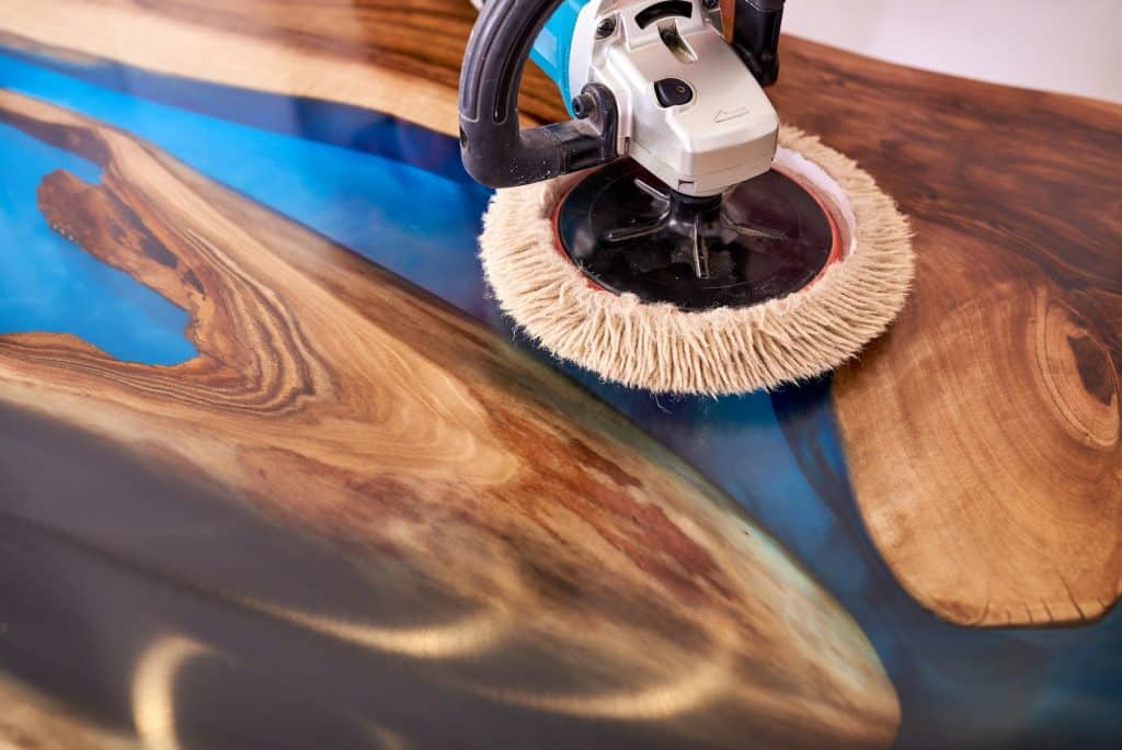 polishing machine with soft disc on epoxy table close up